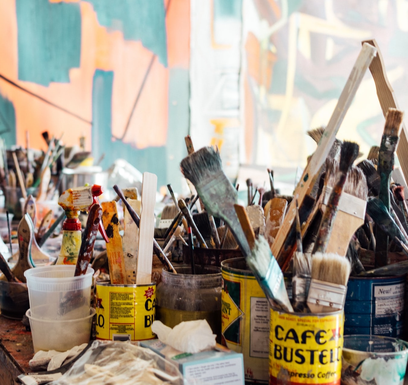 Paintbrushes and art supplies on table