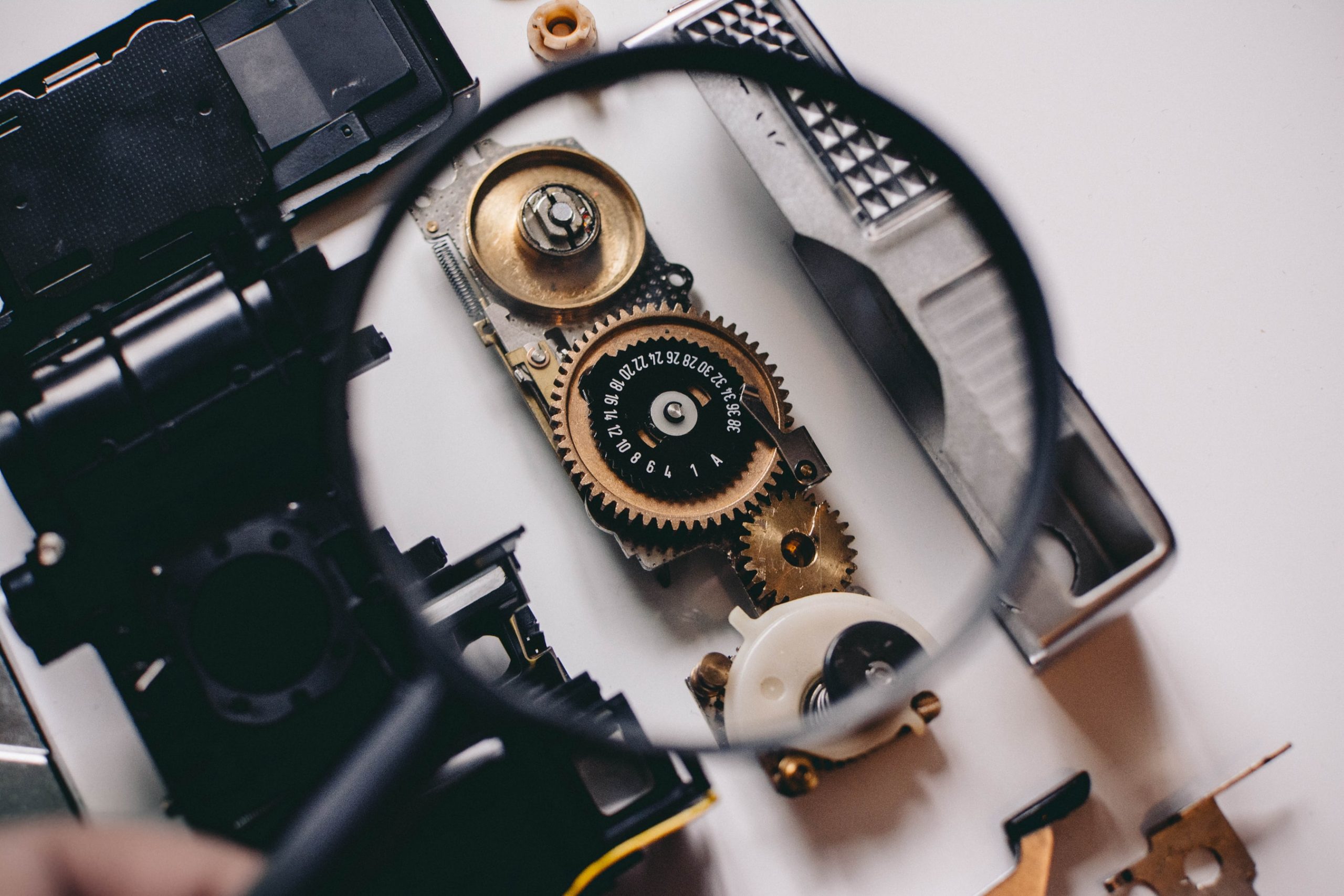 Magnifying glass inspecting gears