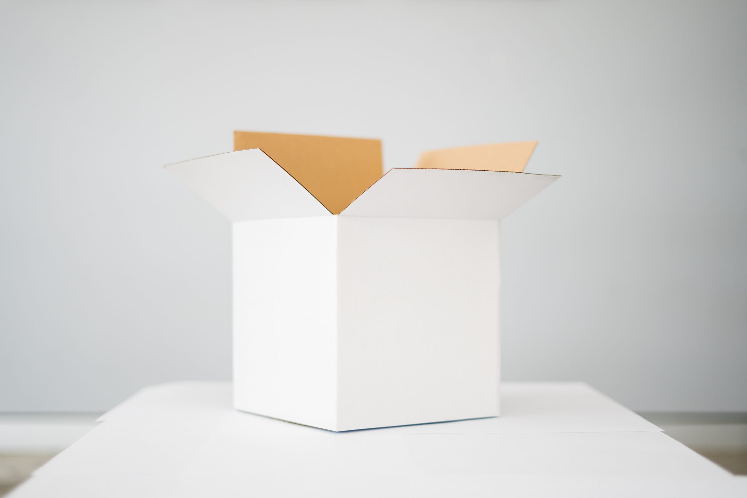 A white box sitting on a table. 