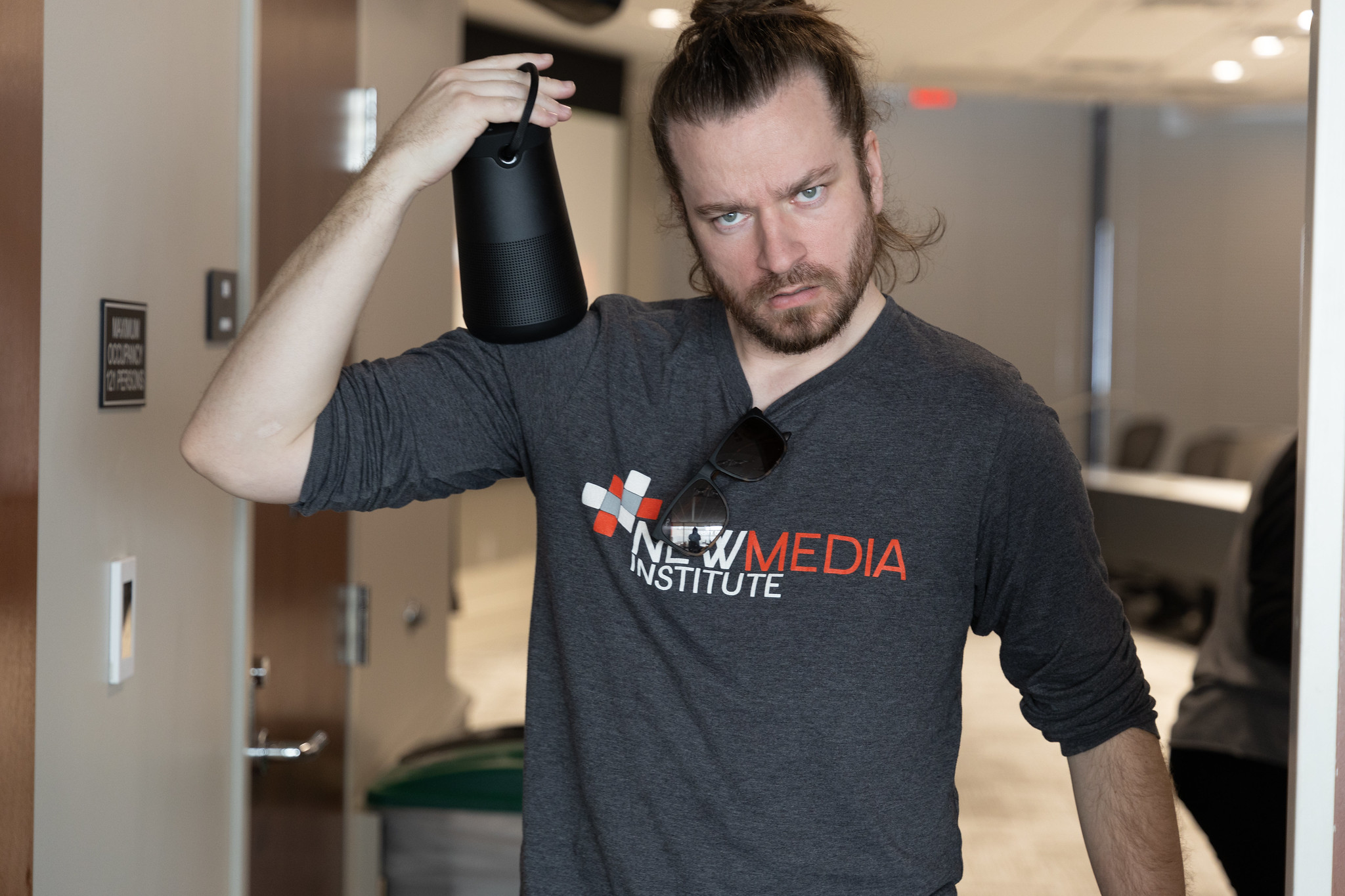 Handsome man carrying modern day boombox